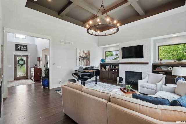 6250 Whispering Hill Ct, Bettendorf, IA 52722 - living area with a towering ceiling, coffered ceiling, a chandelier, beamed ceiling, and plenty of natural light