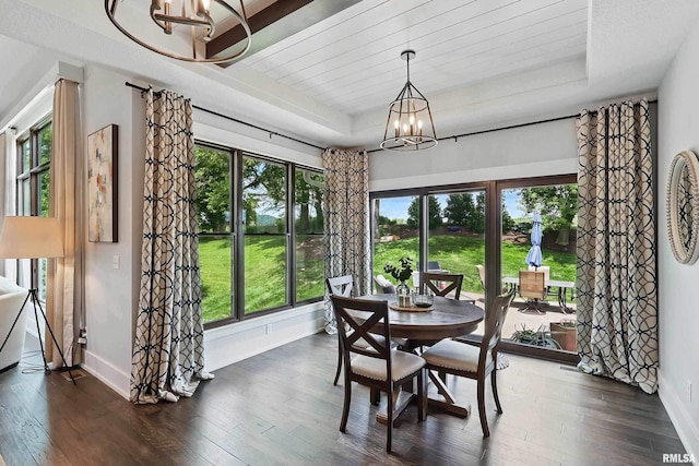 6250 Whispering Hill Ct, Bettendorf, IA 52722 - dining area featuring a chandelier, a tray ceiling, and dark wood-style flooring