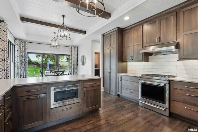 6250 Whispering Hill Ct, Bettendorf, IA 52722 - kitchen with stainless steel gas range, under cabinet range hood, decorative backsplash, light countertops, and a chandelier
