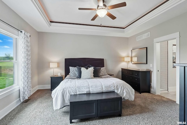6250 Whispering Hill Ct, Bettendorf, IA 52722 - bedroom with carpet flooring, a raised ceiling, crown molding, and ceiling fan