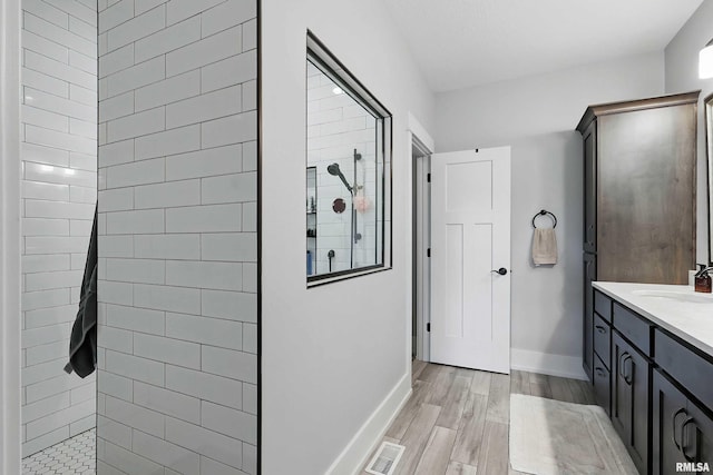 6250 Whispering Hill Ct, Bettendorf, IA 52722 - full bathroom with walk in shower, vanity, and wood finished floors