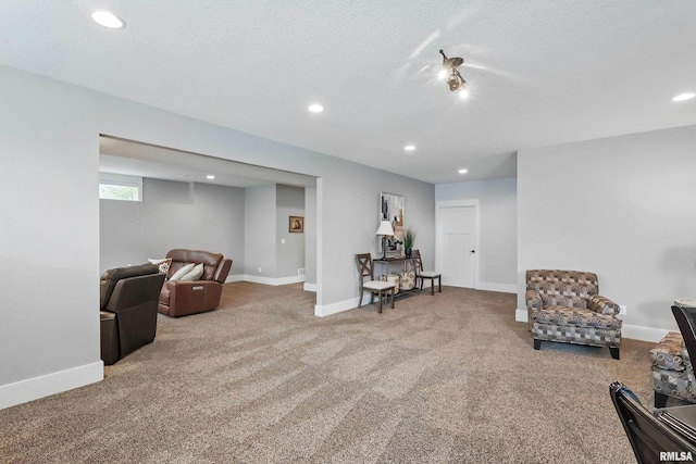 6250 Whispering Hill Ct, Bettendorf, IA 52722 - sitting room with carpet floors, recessed lighting, and a textured ceiling