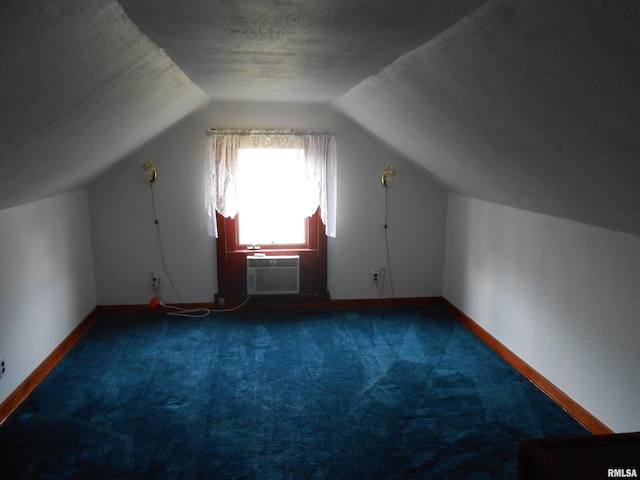 636 3rd St, Buffalo, IA 52728 - bonus room with carpet, lofted ceiling, and an AC wall unit