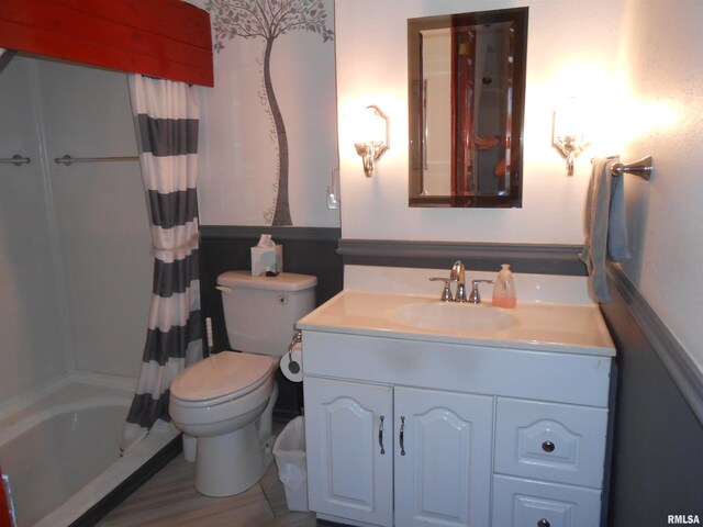 636 3rd St, Buffalo, IA 52728 - full bath with vanity, shower / tub combo, and wood finished floors