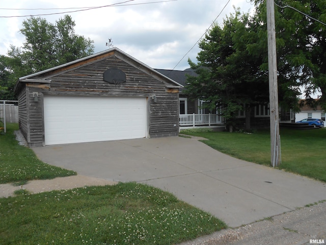 636 3rd St, Buffalo, IA 52728 - view of front of house with a front yard and a garage