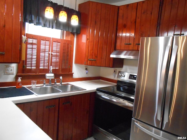 636 3rd St, Buffalo, IA 52728 - kitchen featuring appliances with stainless steel finishes, range hood, light countertops, and brown cabinetry