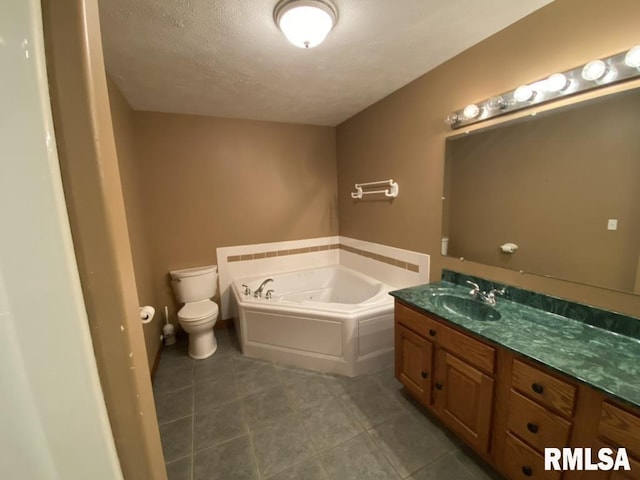1501 Erinberry St, Marion, IL 62959 - full bath with a jetted tub, vanity, tile patterned flooring, and a textured ceiling