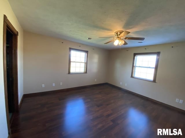 1501 Erinberry St, Marion, IL 62959 - empty room with healthy amount of natural light, ceiling fan, and dark wood-style floors