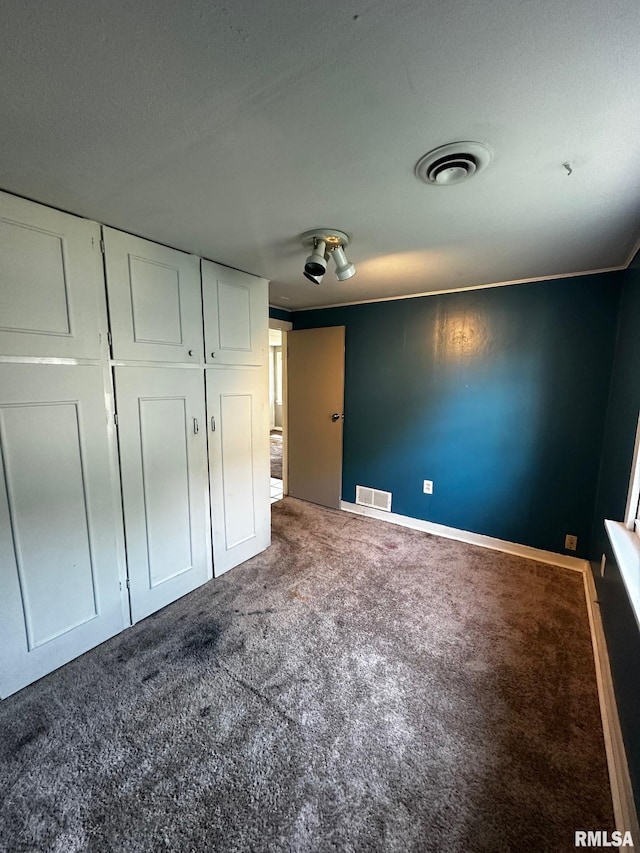 920 5th St, Colona, IL 61241 - unfurnished bedroom featuring carpet flooring and a closet
