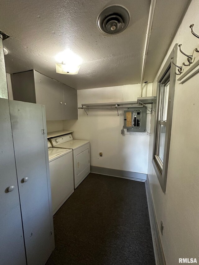 920 5th St, Colona, IL 61241 - laundry area featuring washer and clothes dryer, electric panel, cabinet space, dark colored carpet, and a textured ceiling
