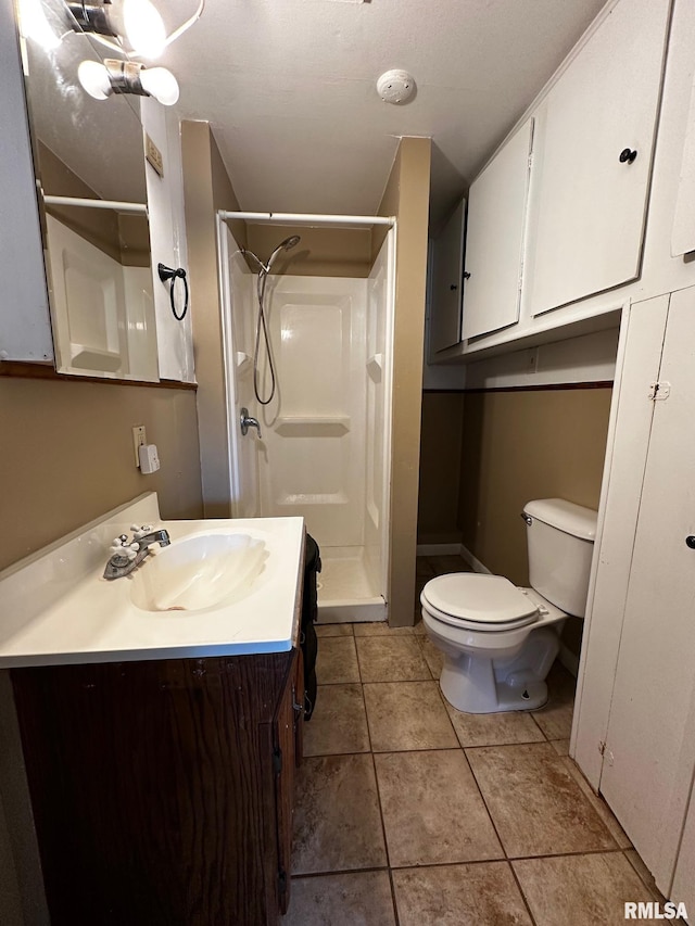 920 5th St, Colona, IL 61241 - full bath with a stall shower, vanity, and tile patterned flooring