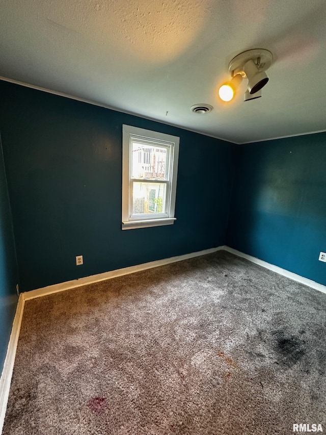 920 5th St, Colona, IL 61241 - carpeted spare room with a textured ceiling and baseboards
