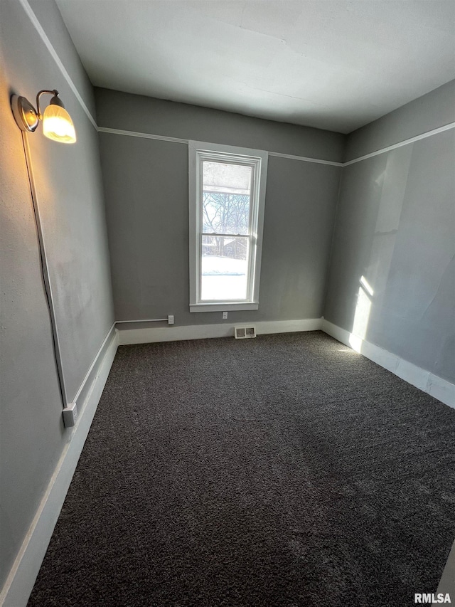201 N 20th St, East Moline, IL 61244 - spare room featuring carpet and baseboards