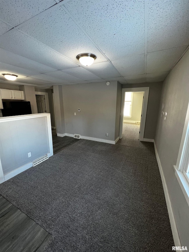 201 N 20th St, East Moline, IL 61244 - unfurnished room featuring baseboards and a paneled ceiling