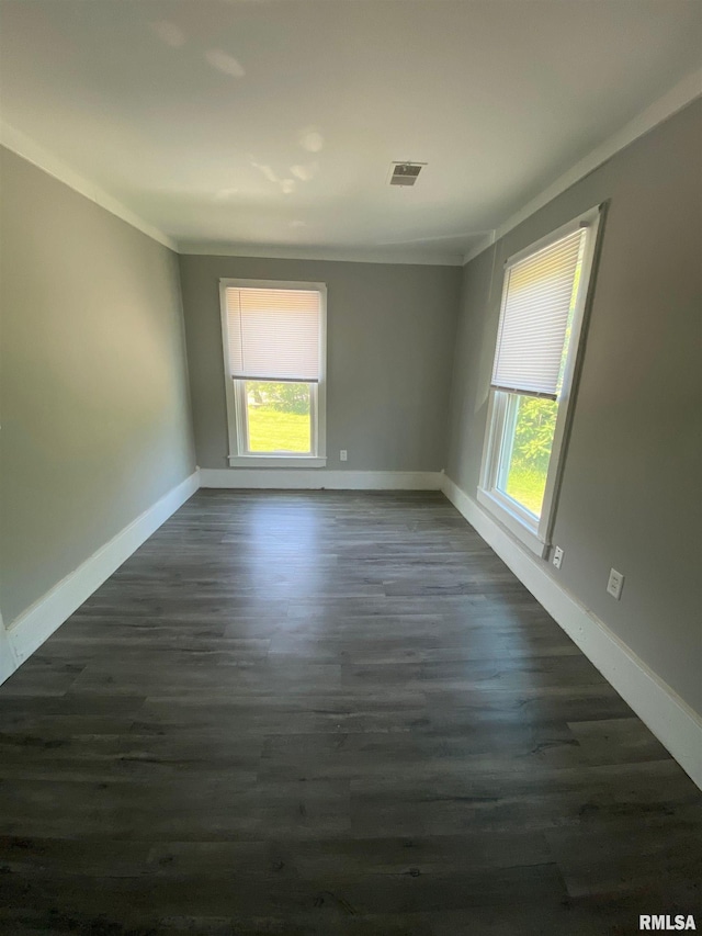 201 N 20th St, East Moline, IL 61244 - unfurnished room featuring ornamental molding and dark wood-style floors