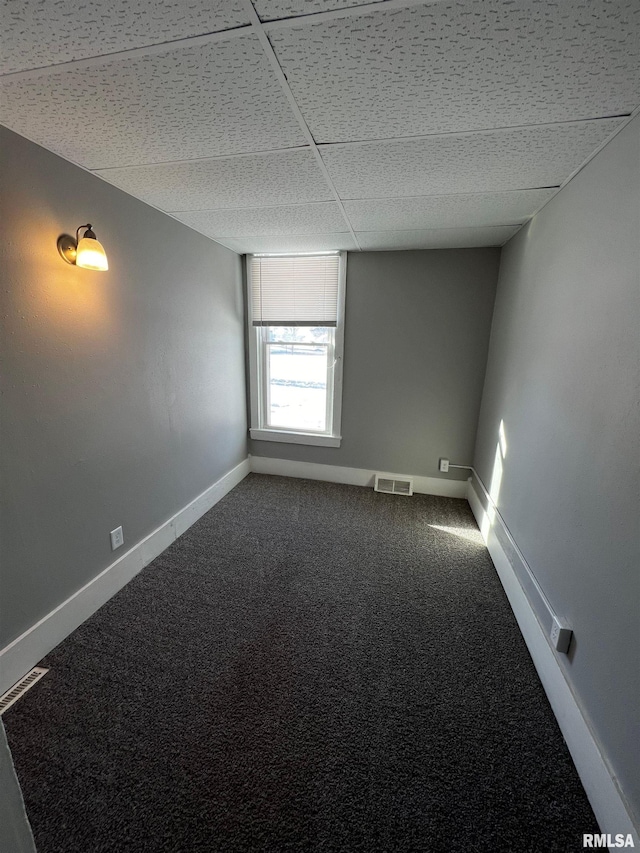 201 N 20th St, East Moline, IL 61244 - spare room with dark carpet and baseboards
