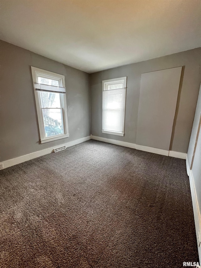 201 N 20th St, East Moline, IL 61244 - unfurnished room with carpet floors and baseboards