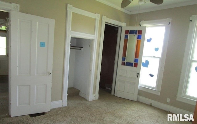504 N College Ave, Aledo, IL 61231 - unfurnished bedroom with ornamental molding, carpet floors, and a closet