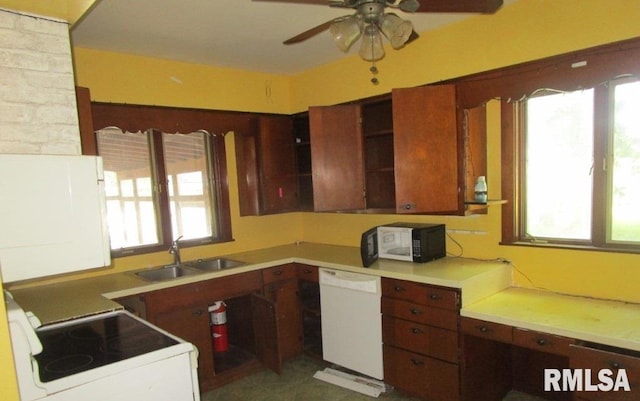 504 N College Ave, Aledo, IL 61231 - kitchen with white appliances, a ceiling fan, and light countertops