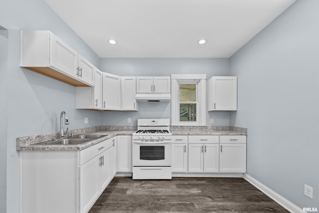 2428 18th Ave, Rock Island, IL 61201 - kitchen featuring white range with gas cooktop, under cabinet range hood, dark wood finished floors, white cabinets, and light countertops