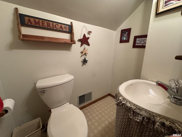 5560 Hidden Acres Ln, Carterville, IL 62918 - bathroom featuring lofted ceiling, tile patterned floors, and vanity