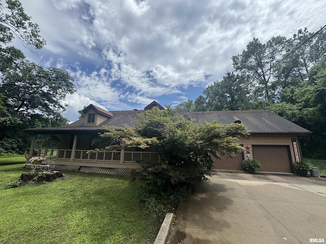 5560 Hidden Acres Ln, Carterville, IL 62918 - view of front of house with driveway, a front yard, and an attached garage