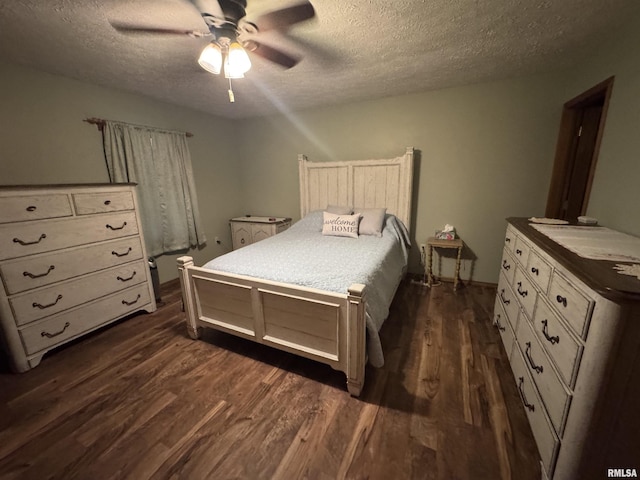 5560 Hidden Acres Ln, Carterville, IL 62918 - bedroom with a textured ceiling, dark wood-style flooring, and a ceiling fan