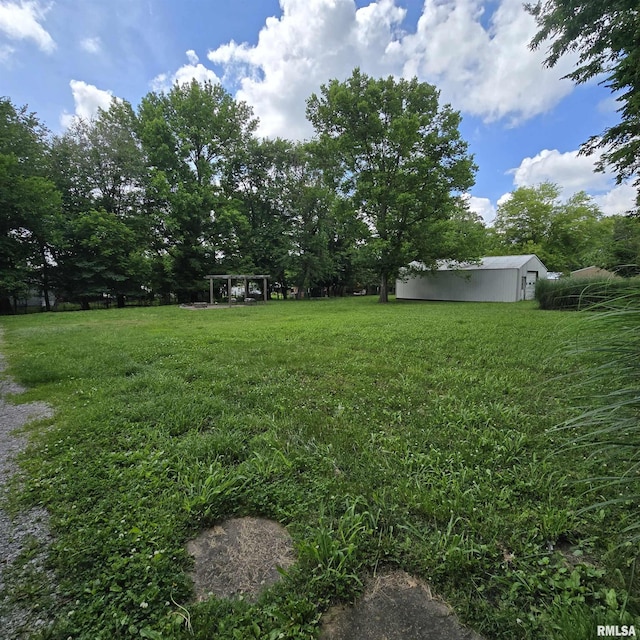 314 Chestnut St, Cambria, IL 62915 - view of green lawn featuring an outbuilding