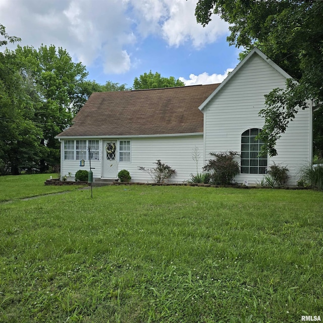 314 Chestnut St, Cambria, IL 62915 - view of front facade with a front lawn and roof with shingles