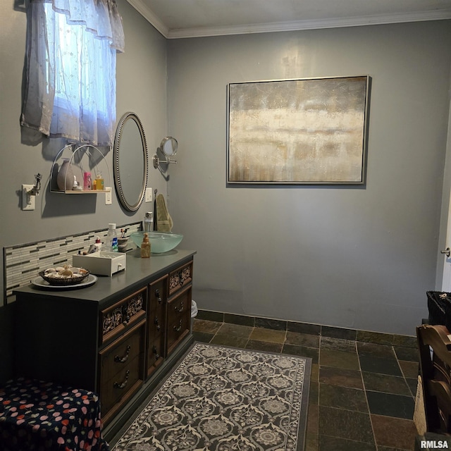 314 Chestnut St, Cambria, IL 62915 - bathroom featuring stone tile flooring, double vanity, backsplash, and ornamental molding