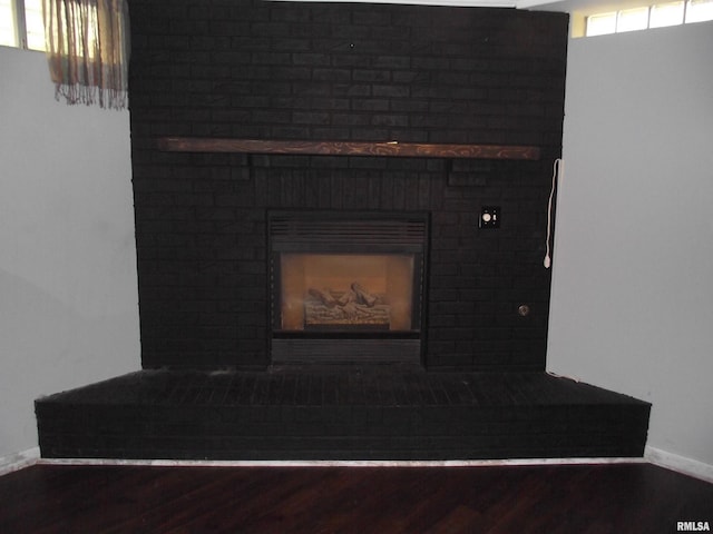 619 E 6th St, Tipton, IA 52772 - detailed view of a fireplace and wood finished floors