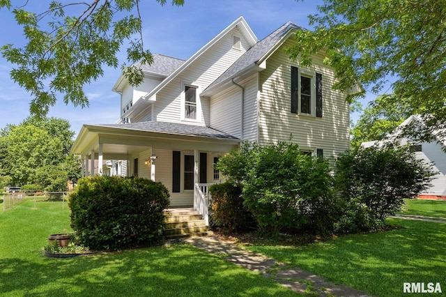 209 N Main St, Alexis, IL 61412 - view of front of home featuring a porch and a shingled roof