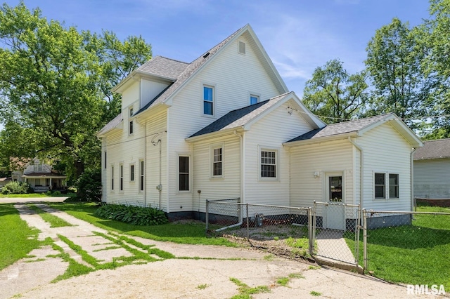 209 N Main St, Alexis, IL 61412 - rear view of house featuring a shingled roof and a gate