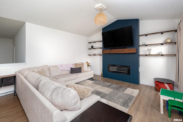 3458 Glenbrook Cir N, Bettendorf, IA 52722 - living room featuring wood finished floors, lofted ceiling, and a fireplace