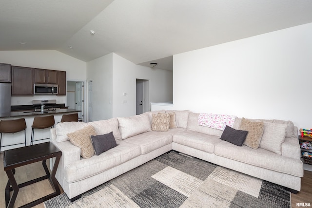 3458 Glenbrook Cir N, Bettendorf, IA 52722 - living area featuring lofted ceiling and wood finished floors