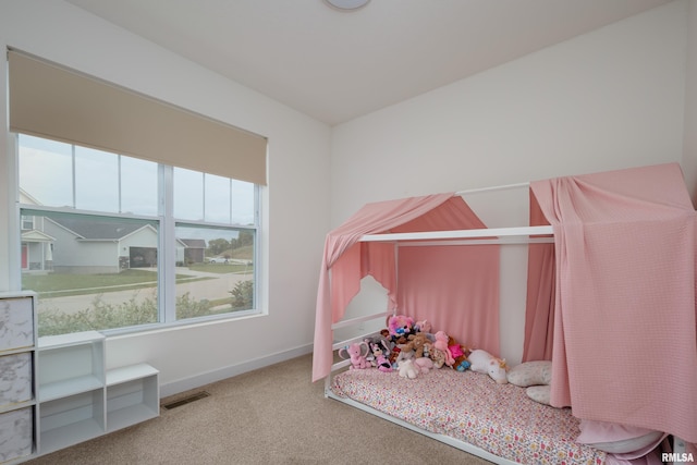 3458 Glenbrook Cir N, Bettendorf, IA 52722 - bedroom featuring carpet and baseboards