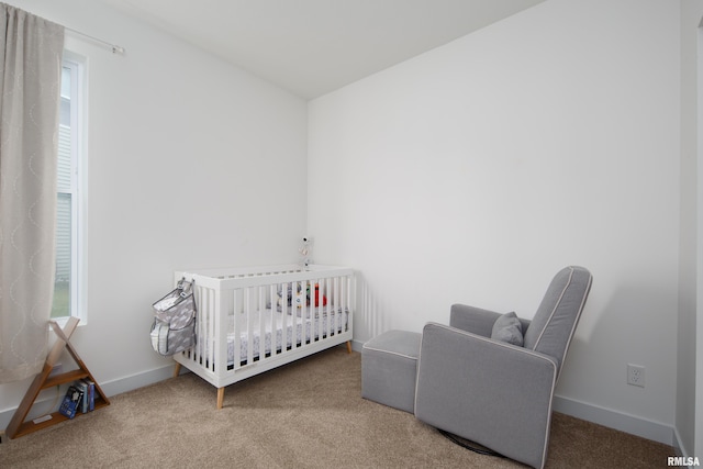 3458 Glenbrook Cir N, Bettendorf, IA 52722 - carpeted bedroom with a crib and baseboards
