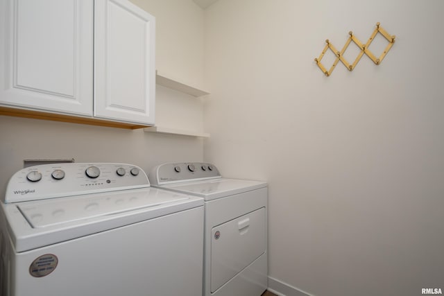 3458 Glenbrook Cir N, Bettendorf, IA 52722 - washroom with washing machine and clothes dryer and cabinet space