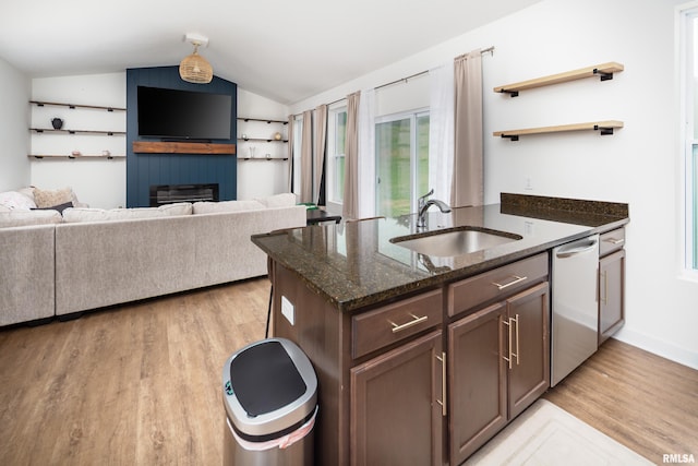 3458 Glenbrook Cir N, Bettendorf, IA 52722 - kitchen with stainless steel dishwasher, lofted ceiling, open shelves, light wood-style flooring, and dark stone countertops