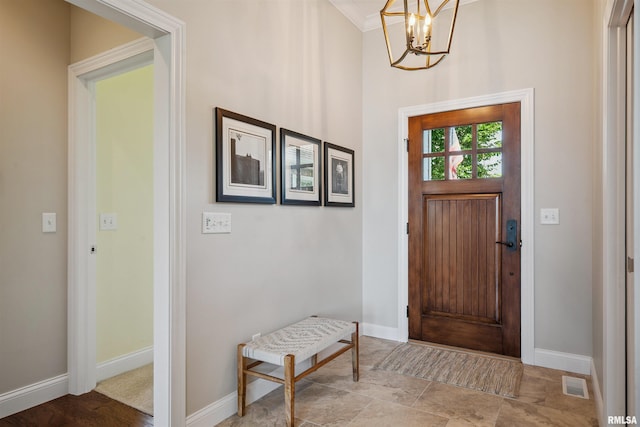 3563 Cobblestone Dr, Bettendorf, IA 52722 - entryway with a chandelier and baseboards