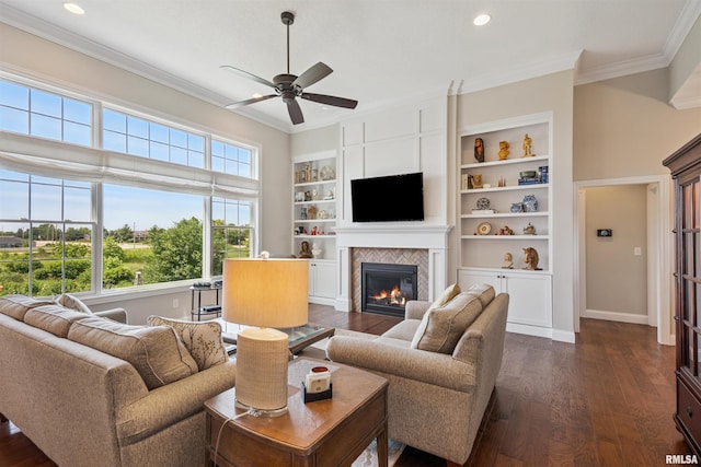3563 Cobblestone Dr, Bettendorf, IA 52722 - living room with crown molding, a fireplace, dark wood-style floors, ceiling fan, and recessed lighting