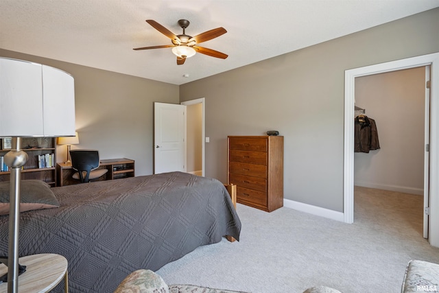 3563 Cobblestone Dr, Bettendorf, IA 52722 - bedroom featuring carpet, a ceiling fan, and a walk in closet