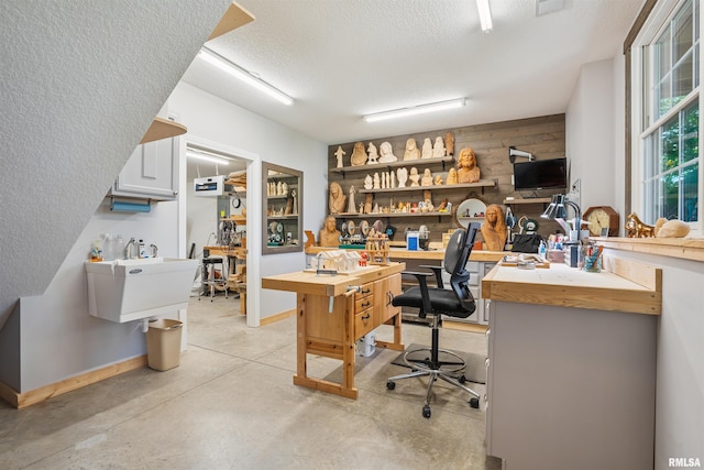 3563 Cobblestone Dr, Bettendorf, IA 52722 - office area featuring a textured ceiling and concrete floors
