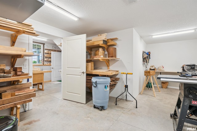 3563 Cobblestone Dr, Bettendorf, IA 52722 - below grade area featuring a textured ceiling