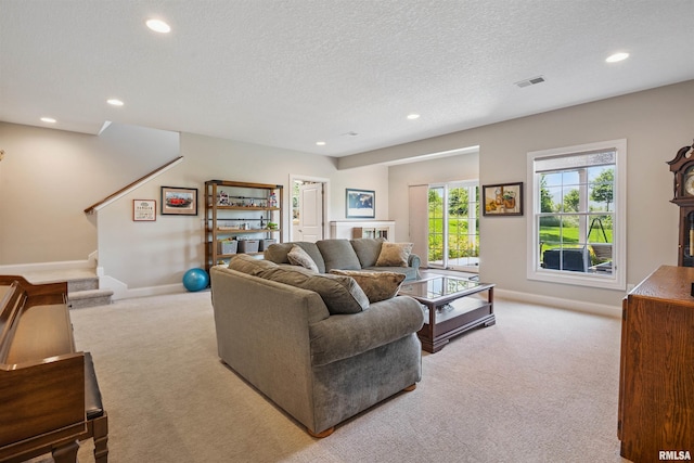 3563 Cobblestone Dr, Bettendorf, IA 52722 - carpeted living area featuring recessed lighting, stairs, and a textured ceiling