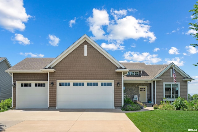 3563 Cobblestone Dr, Bettendorf, IA 52722 - craftsman inspired home with a garage, driveway, a front yard, and a shingled roof