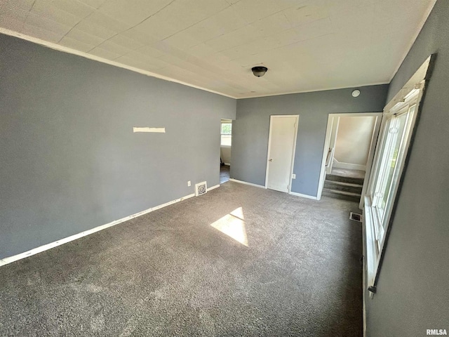 239 15th Ave, East Moline, IL 61244 - unfurnished bedroom featuring carpet floors and baseboards