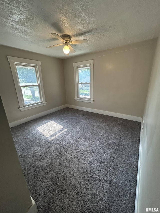 239 15th Ave, East Moline, IL 61244 - carpeted spare room featuring a textured ceiling and a ceiling fan