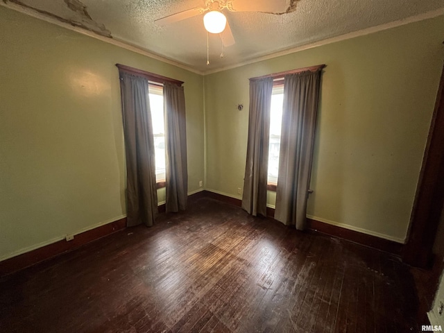 421 W 17th St, Davenport, IA 52803 - spare room featuring a textured ceiling, plenty of natural light, wood finished floors, ceiling fan, and crown molding