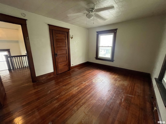 421 W 17th St, Davenport, IA 52803 - unfurnished room featuring a ceiling fan, dark wood-style flooring, and a smoke detector